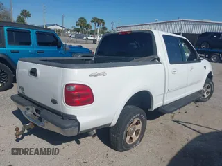 2002 Ford F-150 XLT with VIN 1FTRW08612KD90354, listed as a IAAI auction lot 41308528 with 207,261 mi miles. Bid and sale history available at carsss.com. Image 4.