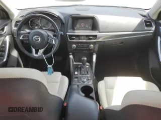2016 Mazda CX-5 Grand Touring z VIN JM3KE2DYXG0731462, wystawiony jako Copart lot #58220465 z przebiegiem 130 033 mil mil oraz Szkoda całkowita • Salvage title. Historia ofert i sprzedaży dostępna na DreamBid. Obrazek 8.