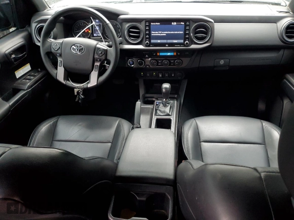 2020 Toyota Tacoma SR5 with VIN 3TMDZ5BN2LM097782, listed as a Copart auction lot 61573465 with 57,321 mi miles and Salvage title. Bid and sale history available at DreamBid. Image 8.