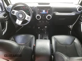 2015 Jeep Wrangler Unlimited Wrangler X with VIN 1C4BJWEG6FL614671, listed as a Copart auction lot 62286095 with 94,928 mi miles and Salvage title. Bid and sale history available at DreamBid. Image 8.