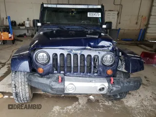 2013 Jeep Wrangler Sahara z VIN 1C4AJWBG4DL504800, wystawiony jako Copart lot #60504575 z przebiegiem 166 687 mil mil oraz Szkoda całkowita • Salvage title. Historia ofert i sprzedaży dostępna na DreamBid. Obrazek 5.