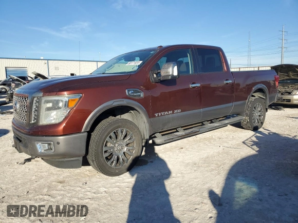 2016 Nissan Titan Platinum Reserve z VIN 1N6BA1F2XGN506885, wystawiony jako Copart lot #80171524 z przebiegiem 318 311 mil mil oraz Czysty tytuł • Clean title. Historia ofert i sprzedaży dostępna na DreamBid. Obrazek 1.