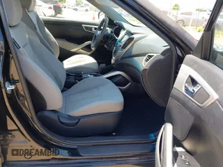 2013 Hyundai Veloster w/Black Int with VIN KMHTC6AD2DU144376, listed as a IAAI auction lot 42720882 with 143,023 mi miles and . Bid and sale history available at DreamBid. Image 5.