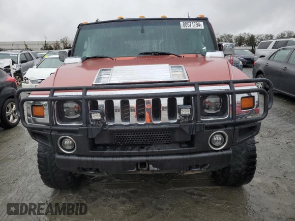 2003 Hummer H2 with VIN 5GRGN23U33H136931, listed as a Copart auction lot 80671794 with 127,137 mi miles and Salvage Title. Bid and sale history available at carsss.com. Image 5.