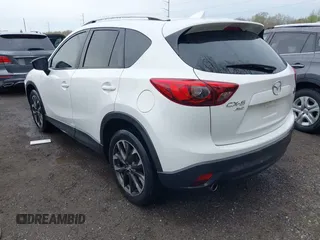 2016 Mazda CX-5 Grand Touring with VIN JM3KE4DY3G0838204, listed as a IAAI auction lot 41961049 with 98,918 mi miles and . Bid and sale history available at carsss.com. Image 3.