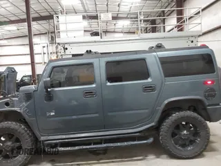 2005 Hummer H2 SUV with VIN 5GRGN23U65H132505, listed as a IAAI auction lot 41515346 with 140,944 mi miles. Bid and sale history available at carsss.com. Image 6.