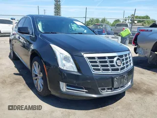 2013 Cadillac XTS Luxury z VIN 2G61R5S32D9226506, wystawiony jako IAAI lot #42208105 z przebiegiem 140 255 mil mil oraz . Historia ofert i sprzedaży dostępna na DreamBid. Obrazek 1.