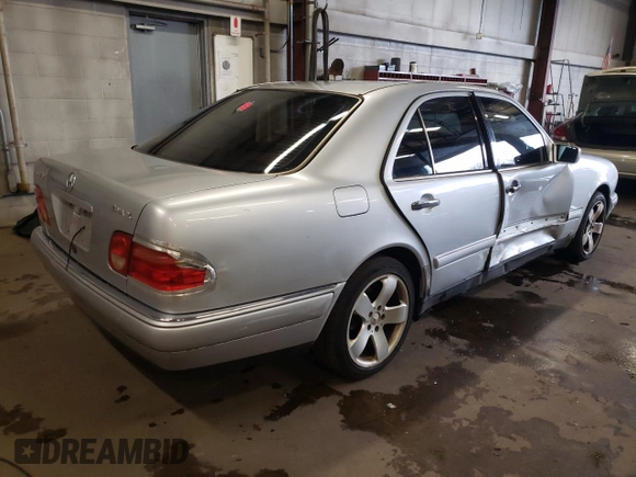 1999 Mercedes-Benz E-Class with VIN WDBJF82H4XX021888, listed as a Copart auction lot 83069274 with 173,198 mi miles and Salvage Title. Bid and sale history available at carsss.com. Image 3.