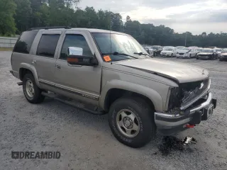 2000 Chevrolet Tahoe Z71 with VIN 1GNEK13R7YR189177, listed as a Copart auction lot 56830725 with 308,270 mi miles and Salvage title. Bid and sale history available at DreamBid. Image 4.