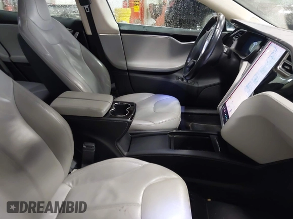 2014 Tesla Model S 60 with VIN 5YJSA1H16EFP52853, listed as a IAAI auction lot 41941989 with 132,038 mi miles and . Bid and sale history available at DreamBid. Image 5.