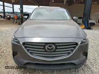 2020 Mazda CX-9 Touring z VIN JM3TCACY3L0411822, wystawiony jako Copart lot #60323295 z przebiegiem 61 348 mil mil oraz Szkoda całkowita • Salvage title. Historia ofert i sprzedaży dostępna na DreamBid. Obrazek 5.