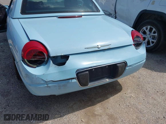2003 Ford Thunderbird Deluxe z VIN 1FAHP60A53Y101461, wystawiony jako IAAI lot #42519933 z przebiegiem 64 820 mil mil oraz . Historia ofert i sprzedaży dostępna na DreamBid. Obrazek 6.