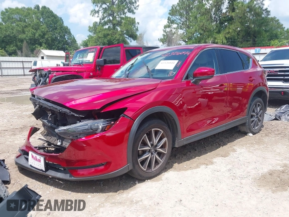 2018 Mazda CX-5 Grand Touring with VIN JM3KFADM4J0335913, listed as a IAAI auction lot 42326044 with 104,583 mi miles and . Bid and sale history available at DreamBid. Image 2.