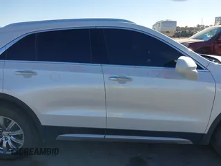 2020 Cadillac XT4 AWD Premium Luxury z VIN 1GYFZDR46LF083118, wystawiony jako IAAI lot #40495567 z przebiegiem 83 224 mil mil oraz . Historia ofert i sprzedaży dostępna na DreamBid. Obrazek 13.