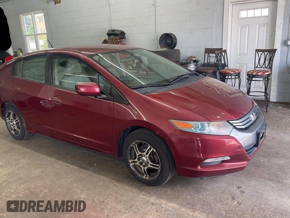 2010 Honda Insight LX with VIN JHMZE2H59AS032860, listed as a Copart auction lot 60861945 with 253,444 mi miles and Clean title. Bid and sale history available at DreamBid. Image 1.