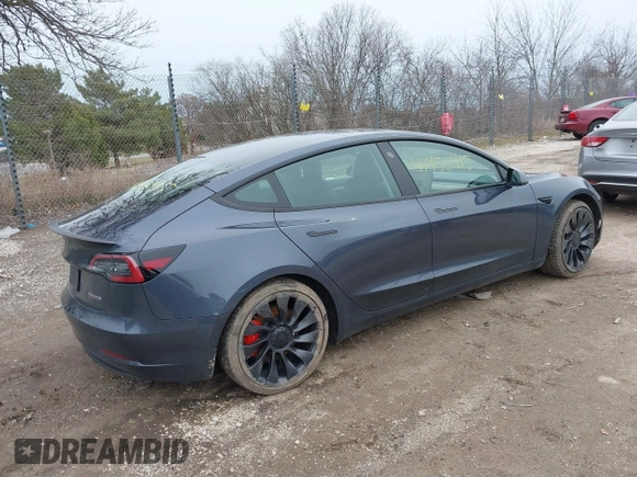 2023 Tesla Model 3 Performance with VIN 5YJ3E1EC9PF407365, listed as a IAAI auction lot 41956915 with 31,087 mi miles. Bid and sale history available at carsss.com. Image 4.