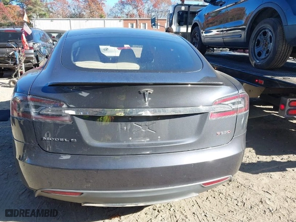 2014 Tesla Model S P85D with VIN 5YJSA1H23EFP62992, listed as a IAAI auction lot 40857026 with 107,184 mi miles. Bid and sale history available at carsss.com. Image 17.