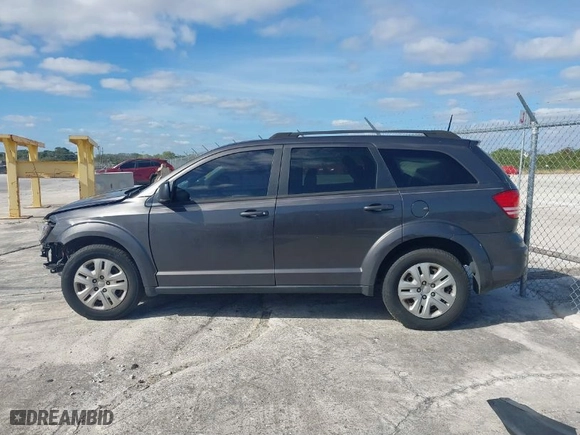 2019 Dodge Journey SE Value Pkg with VIN 3C4PDCAB7KT747315, listed as a IAAI auction lot 41028740 with 143,469 mi miles. Bid and sale history available at carsss.com. Image 14.