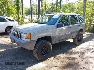 1998 Jeep Grand Cherokee Laredo with VIN 1J4GZ58S6WC154415, listed as a IAAI auction lot 42331831 with 163,723 mi miles and . Bid and sale history available at DreamBid. Image 2.