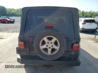 1999 Jeep Wrangler Sport with VIN 1J4FY19S6XP445867, listed as a Copart auction lot 62223125 with 146,037 mi miles and Salvage title. Bid and sale history available at DreamBid. Image 6.
