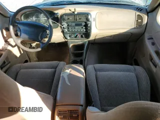 1997 Ford Explorer XL with VIN 1FMDU34E5VZB40878, listed as a Copart auction lot 84009744 with 185,047 mi miles and Salvage title. Bid and sale history available at DreamBid. Image 8.