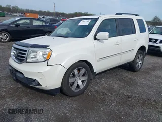 2014 Honda Pilot Touring with VIN 5FNYF4H97EB046879, listed as a IAAI auction lot 42017280 with 167,564 mi miles and . Bid and sale history available at carsss.com. Image 2.