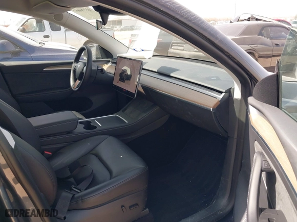 2023 Tesla Model Y Long Range with VIN 7SAYGDEE5PA035722, listed as a IAAI auction lot 41726067 with 34,357 mi miles. Bid and sale history available at carsss.com. Image 5.
