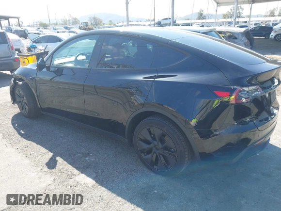 2025 Tesla Model Y Long Range with VIN 7SAYGDEE9SF278607, listed as a IAAI auction lot 41932084 with 9,667 mi miles and . Bid and sale history available at carsss.com. Image 3.