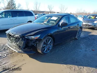 2021 Mazda Mazda6 Touring with VIN JM1GL1VM5M1613920, listed as a IAAI auction lot 41115190 with 56,823 mi miles. Bid and sale history available at carsss.com. Image 2.