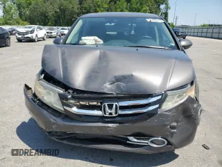 2014 Honda Odyssey Touring with VIN 5FNRL5H93EB061754, listed as a Copart auction lot 55182015 with 168,058 mi miles and Salvage title. Bid and sale history available at DreamBid. Image 5.