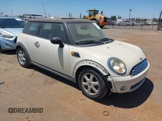 2010 MINI Hardtop with VIN WMWMF3C51ATZ23464, listed as a IAAI auction lot 42710259 with 124,660 mi miles and . Bid and sale history available at DreamBid. Image 1.