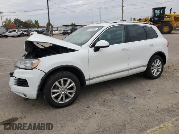 2014 Volkswagen Touareg Sport with VIN WVGEF9BP3ED005921, listed as a Copart auction lot 77372514 with 156,753 mi miles and Salvage Title. Bid and sale history available at DreamBid. Image 1.