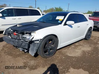 2012 Chrysler 300 SRT-8 with VIN 2C3CCAFJ9CH801749, listed as a IAAI auction lot 40912606 with 144,404 mi miles and . Bid and sale history available at DreamBid. Image 18.