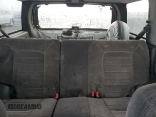 1998 Jeep Grand Cherokee Laredo with VIN 1J4GZ48S1WC165851, listed as a Copart auction lot 84110044 with 306,484 mi miles and Salvage Title. Bid and sale history available at carsss.com. Image 10.