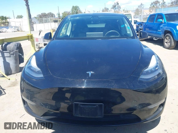 2020 Tesla Model Y Long Range with VIN 5YJYGDEE2LF059177, listed as a IAAI auction lot 41916260 with 66,190 mi miles and . Bid and sale history available at DreamBid. Image 12.