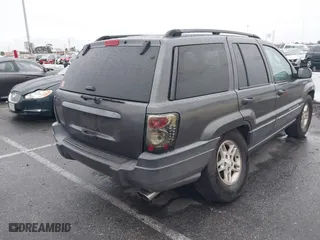 2004 Jeep Grand Cherokee Laredo with VIN 1J4GX48S14C177923, listed as a IAAI auction lot 41745772 with 242,506 mi miles. Bid and sale history available at carsss.com. Image 4.