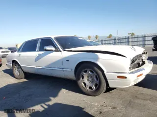 2001 Jaguar XJ VDP with VIN SAJDA24C11LF28715, listed as a Copart auction lot 65246334 with 107,965 mi miles and Salvage Title. Bid and sale history available at carsss.com. Image 4.