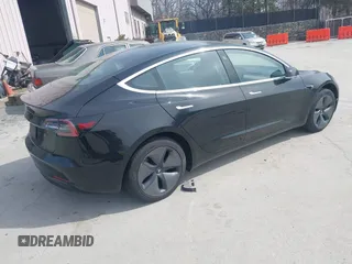 2020 Tesla Model 3 Standard Range Plus with VIN 5YJ3E1EAXLF643807, listed as a IAAI auction lot 41789406 with 49,256 mi miles. Bid and sale history available at carsss.com. Image 4.