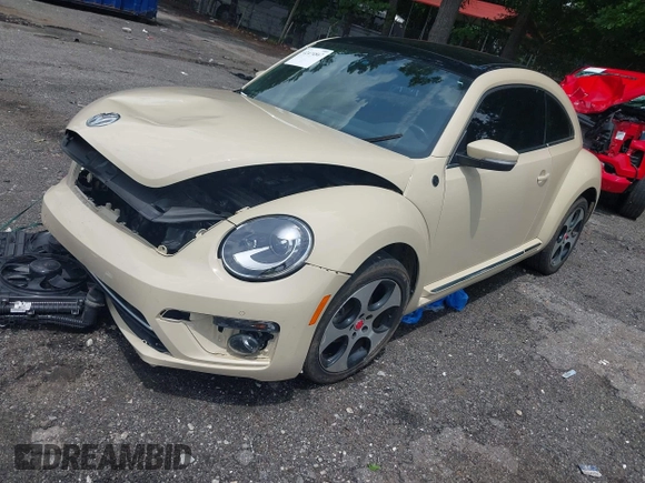 2019 Volkswagen Beetle S with VIN 3VWFD7AT2KM700941, listed as a IAAI auction lot 42474867 with 43,891 mi miles and . Bid and sale history available at DreamBid. Image 2.
