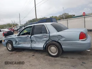 1999 Ford Crown Victoria z VIN 2FAFP73WXXX221069, wystawiony jako IAAI lot #41750127 z przebiegiem 177 142 mil mil oraz . Historia ofert i sprzedaży dostępna na DreamBid. Obrazek 14.