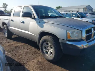 2005 Dodge Dakota SLT with VIN 1D7HW48N05S227358, listed as a IAAI auction lot 42636439 with 128,718 mi miles and . Bid and sale history available at DreamBid. Image 1.