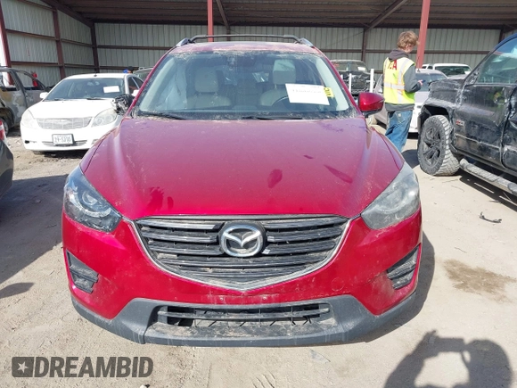 2016 Mazda CX-5 Grand Touring with VIN JM3KE4DY0G0709563, listed as a IAAI auction lot 41886956 with 156,769 mi miles. Bid and sale history available at carsss.com. Image 13.
