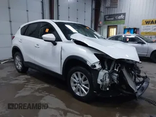 2014 Mazda CX-5 Touring with VIN JM3KE4CY4E0349034, listed as a IAAI auction lot 41478954 with 117,502 mi miles. Bid and sale history available at carsss.com. Image 1.