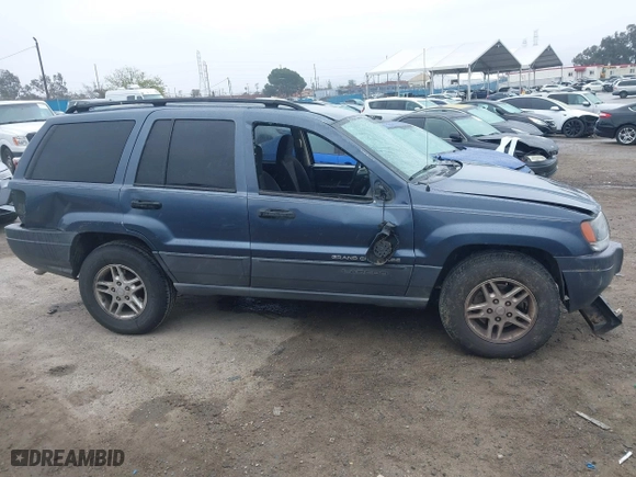 2004 Jeep Grand Cherokee Laredo with VIN 1J4GX48S64C291075, listed as a IAAI auction lot 41805747 with 282,384 mi miles. Bid and sale history available at carsss.com. Image 13.