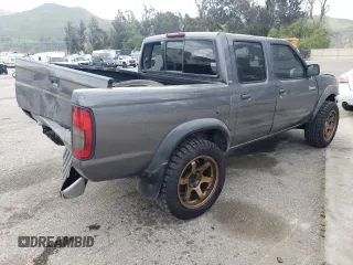 2000 Nissan Frontier XE with VIN 1N6ED27T5YC426456, listed as a Copart auction lot 54411425 with 117,600 mi miles and Salvage title. Bid and sale history available at DreamBid. Image 3.