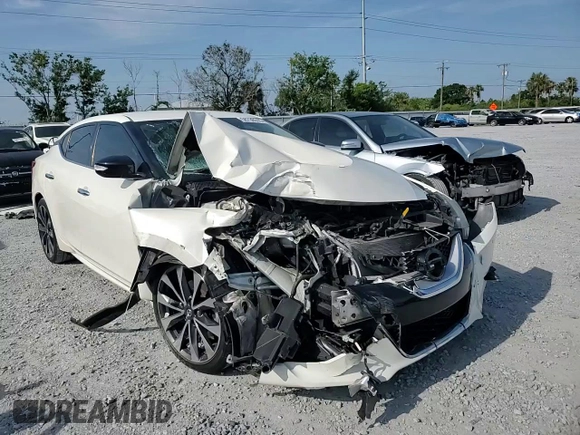 2016 Nissan Maxima SR with VIN 1N4AA6AP5GC421677, listed as a Copart auction lot 58738515 with 140,920 mi miles and Salvage title. Bid and sale history available at DreamBid. Image 14.