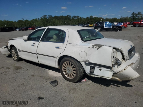 2004 Lincoln Town Car Signature with VIN 1LNHM81W04Y603672, listed as a Copart auction lot 52566725 with 214,180 mi miles and Salvage Title. Bid and sale history available at carsss.com. Image 2.