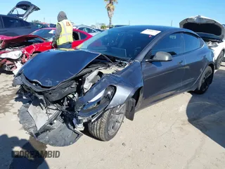 2022 Tesla Model 3 with VIN 5YJ3E1EA3NF165054, listed as a IAAI auction lot 41805729 with 225,773 mi miles. Bid and sale history available at carsss.com. Image 2.