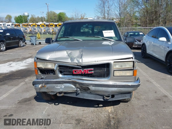 1999 GMC Suburban with VIN 3GKFK16R4XG514928, listed as a IAAI auction lot 41934636 with 245,010 mi miles and . Bid and sale history available at DreamBid. Image 12.
