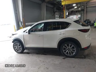 2020 Mazda CX-5 Grand Touring with VIN JM3KFADMXL0742038, listed as a IAAI auction lot 42292400 with 68,339 mi miles and . Bid and sale history available at DreamBid. Image 15.
